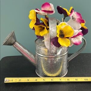 Cute tin watering can with silk pansies